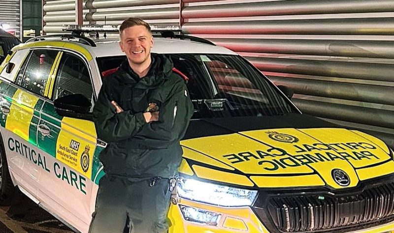 Critical Care Paramedic, Bradley Gander leaning against a critical care single responder vehicle