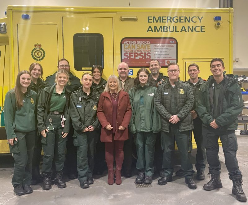 Cardiac arrest survivor, Anne, her husband Martin and 11 of the ambulance team who helped her at Medway MRC.