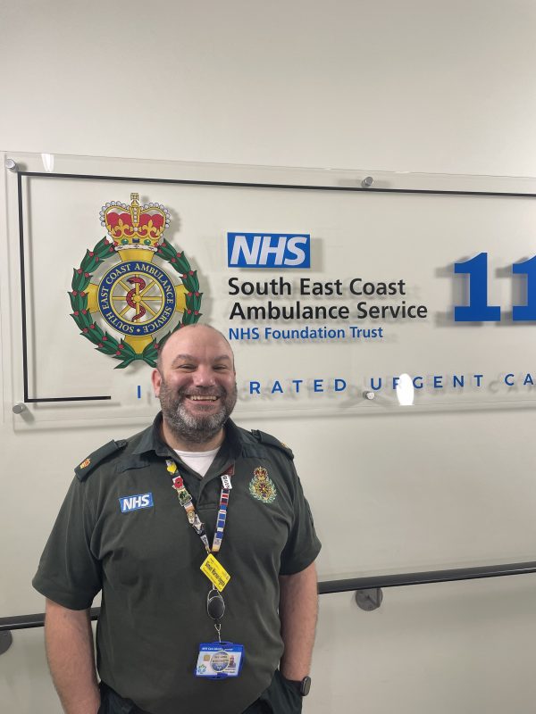 Man in ambulance uniform smiling