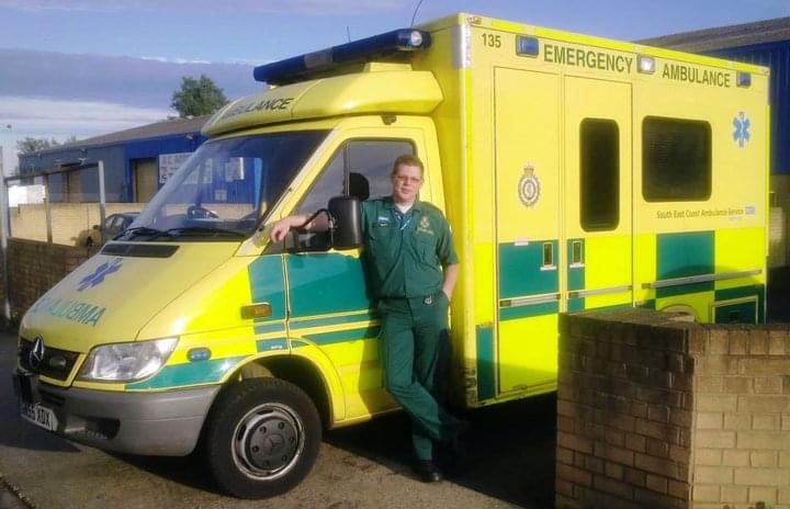 Photo of SECAmb's Gary Turley c.2002 standing in front of an ambulance