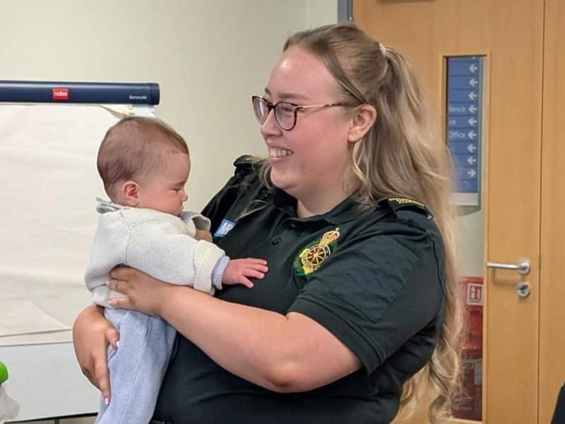 SECAmb call handler holding and meeting baby she helped deliver during a 999 call at Polegate Make Ready Centre.