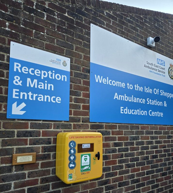 Yellow defibrillator on the wall outside Sheppey ambulance station